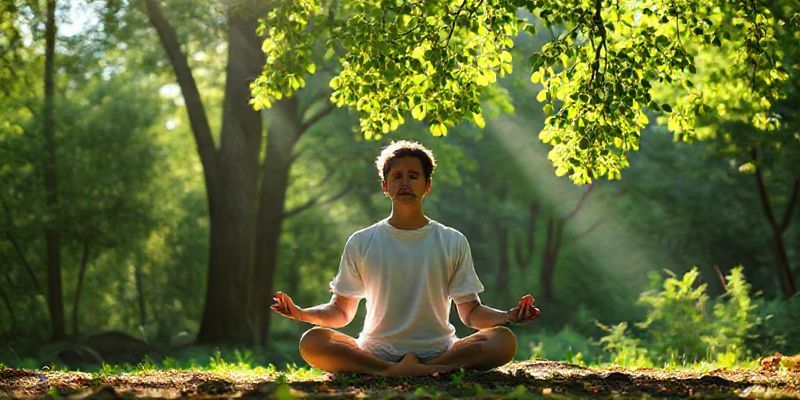 A person meditating in a serene natural setting, with soft sunlight filtering through leaves