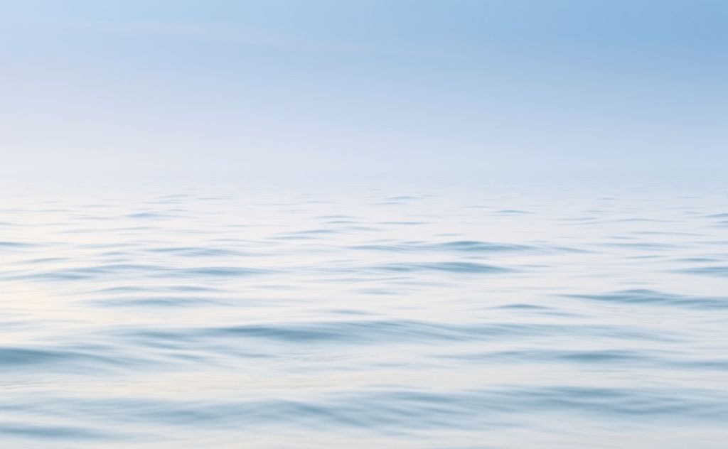 A serene landscape with gentle waves and soft, calming colors.
