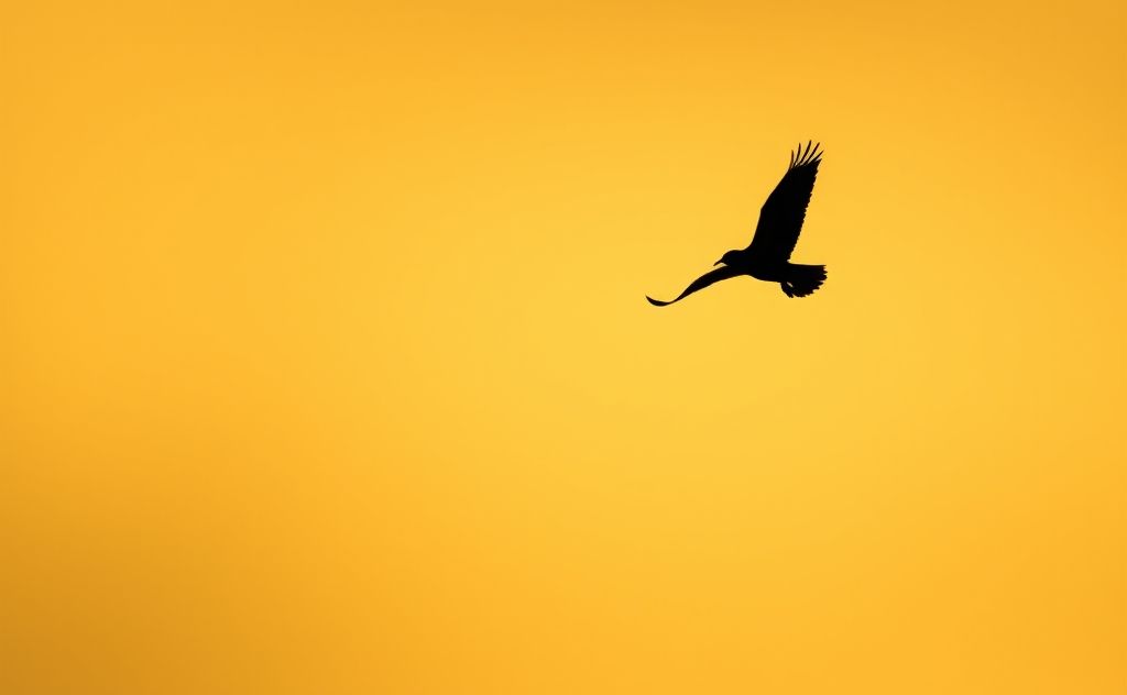 A silhouette of a bird flying away from a looming shadow.