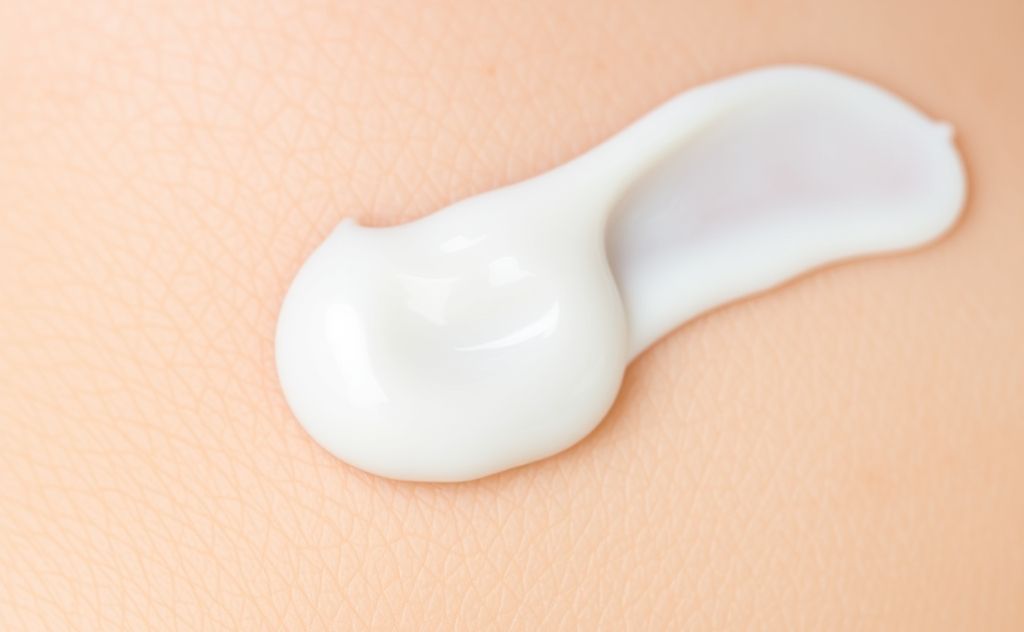A close-up of a soothing cream applied to irritated skin.